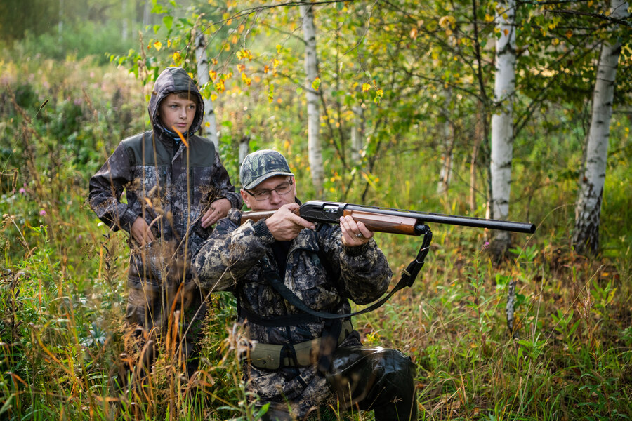 son and dad hunting moose